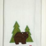 This towel includes applique bear, trees and your name.