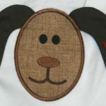 This applique is a 3D design.  The ears are sewn separately and then sewn on the head of the dog.  Add $5.00 for this applique.