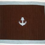 An anchor applique and last name were added to these pillow shams.